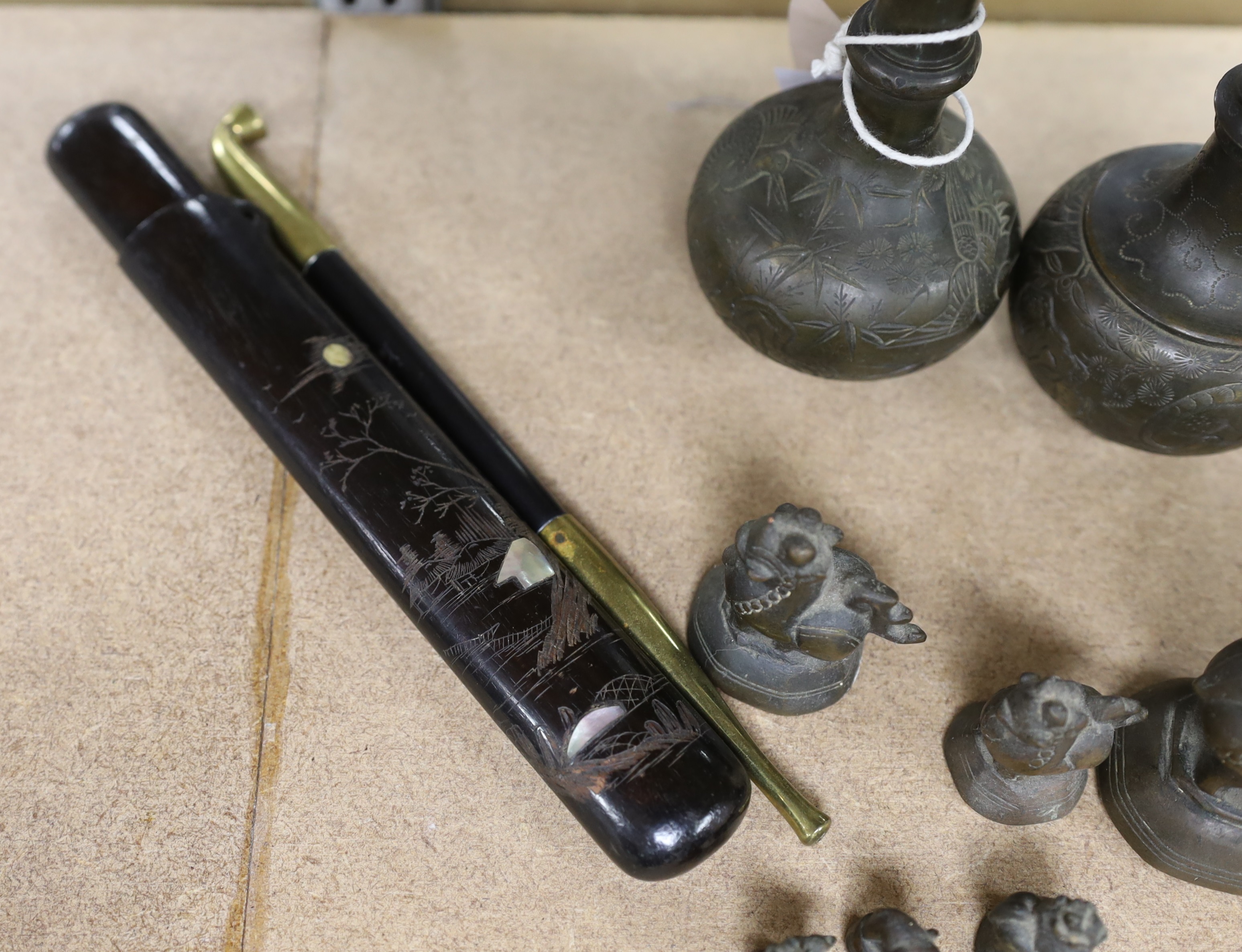 A set of Burmese bronze weights and a pair of bronze vases, 12cm